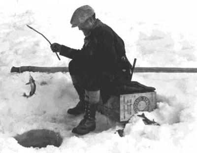 old photo of a man ice fishing