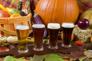 oktoberfest beer flight of four samples with fall seasonal decoration